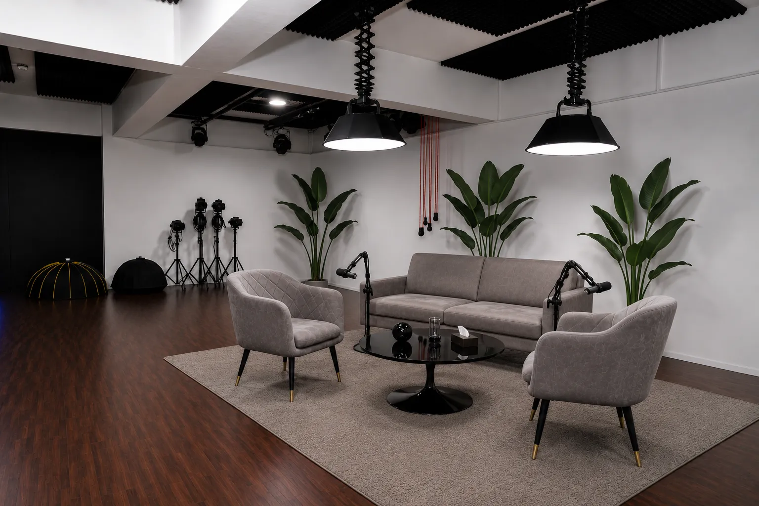 Wide view of the podcast studio floor at Nearby Studio, Rajajinagar, with sofa seating, mics and overhead lights